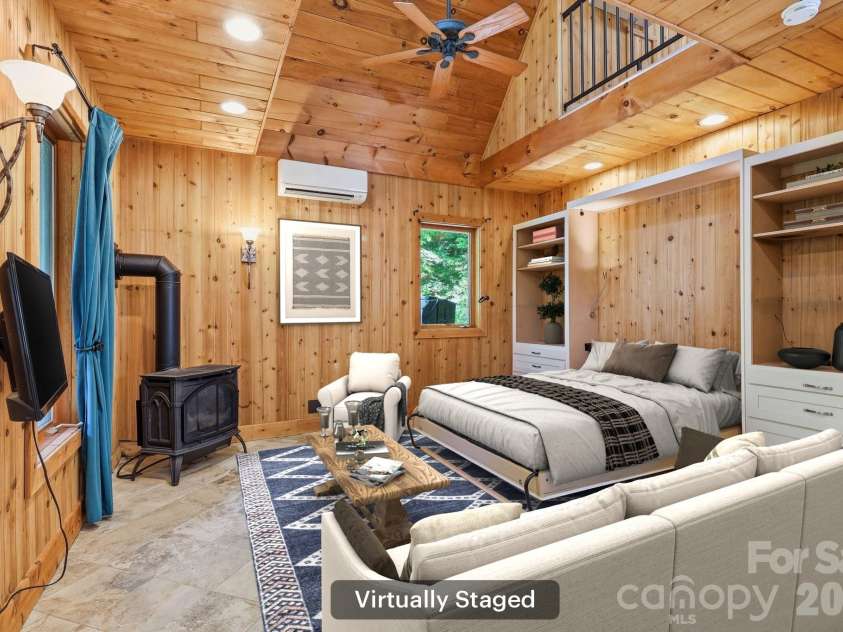 98 Sparkling Springs Road, Fairview, NC 28730.  MLS# CAR4376359, YatesRealty ID 25953. Virtually Staged Murphy Bed in Living Room