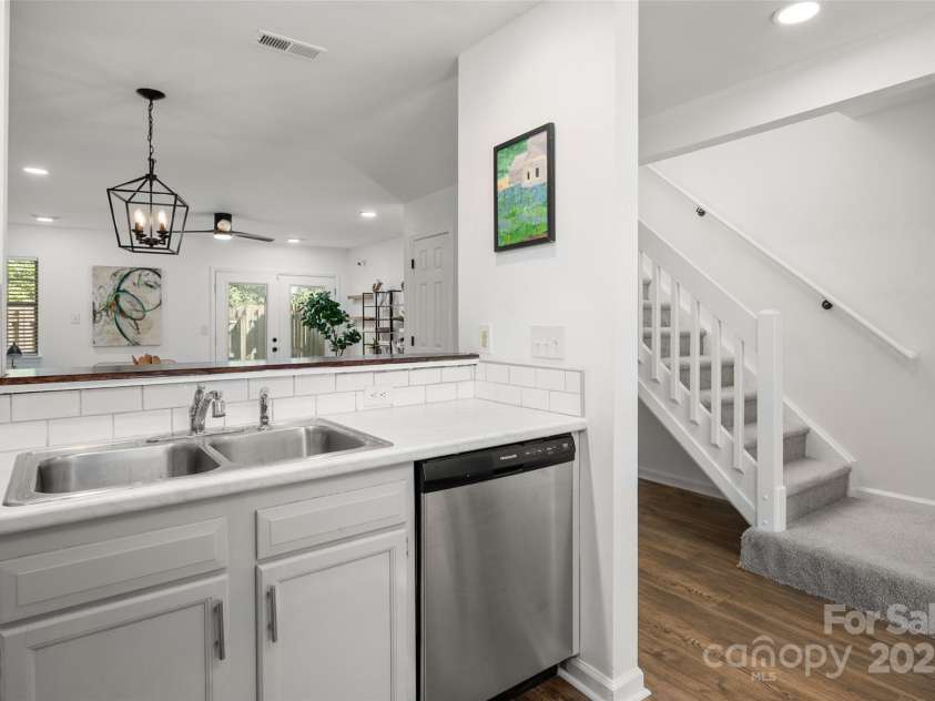 3638 Huyton Court, Charlotte, NC 28215.  MLS# CAR4279727, YatesRealty ID 25956. Kitchen with view to hall way and stairs