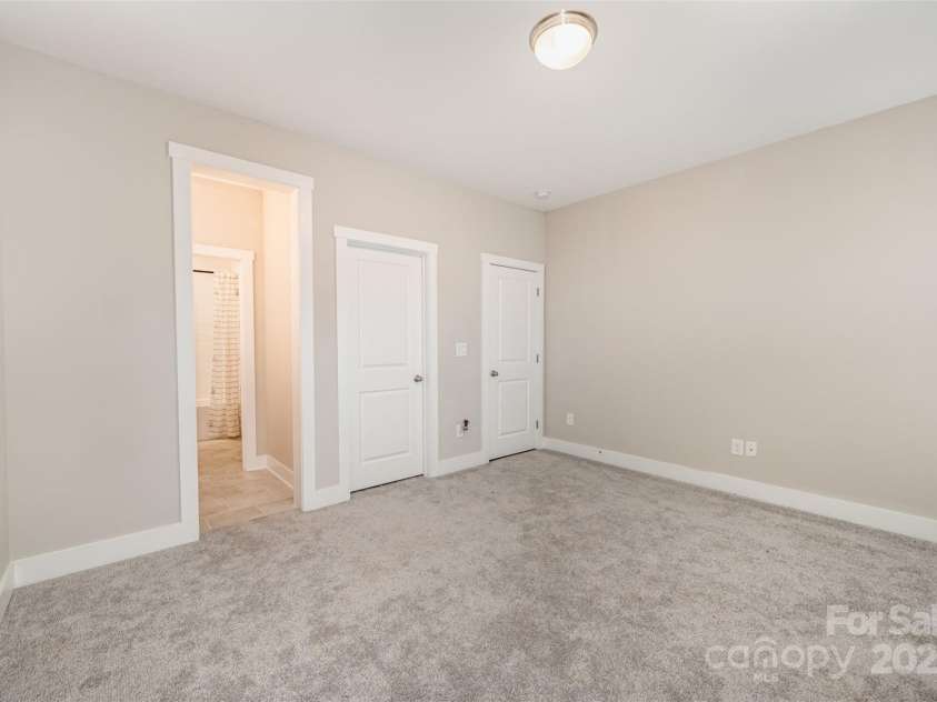 2332 Paddlers Cove Drive, Clover, SC 29710.  MLS# CAR4242429, YatesRealty ID 25958. Bedroom #3 with view to ensuite bathroom.