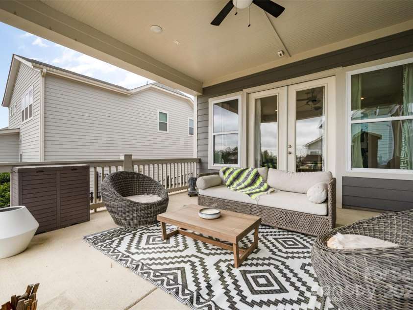 2332 Paddlers Cove Drive, Clover, SC 29710.  MLS# CAR4242429, YatesRealty ID 25958. First covered patio with French door access to family room.  In-ceiling speaker prewire.  Can easily be screened in.  Has gasline so this could be upgraded to an outdoor kitchen. Ceiling fan.