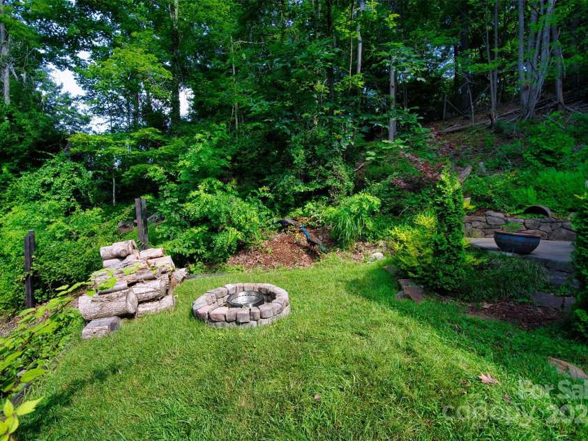 100 Ballantree Drive, Asheville, NC 28803.  MLS# CAR4277967, YatesRealty ID 25963. Fire Pit Below the Patio