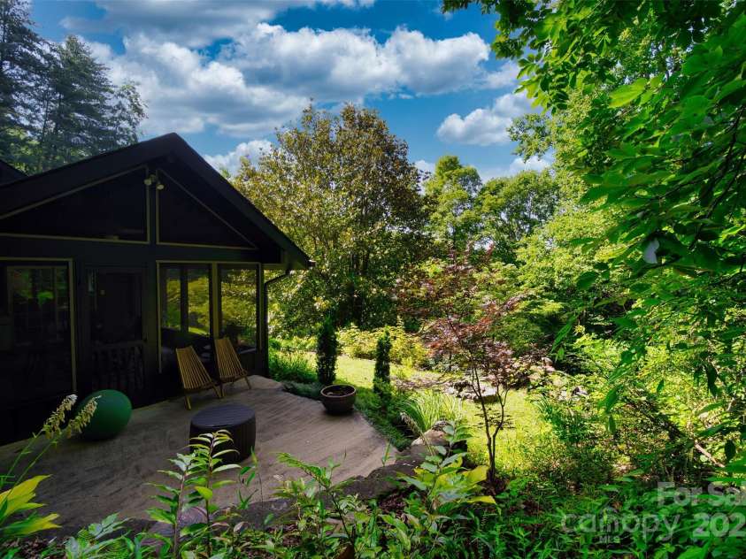100 Ballantree Drive, Asheville, NC 28803.  MLS# CAR4277967, YatesRealty ID 25963. Patio Just Outside the Screened in Porch