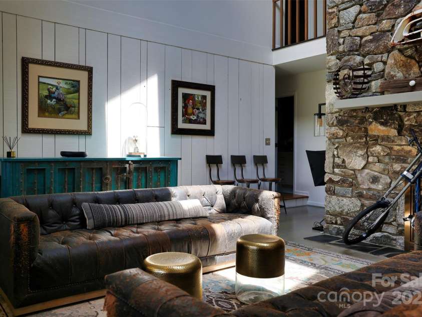 100 Ballantree Drive, Asheville, NC 28803.  MLS# CAR4277967, YatesRealty ID 25963. Two Story Stone Fireplace in Great Room