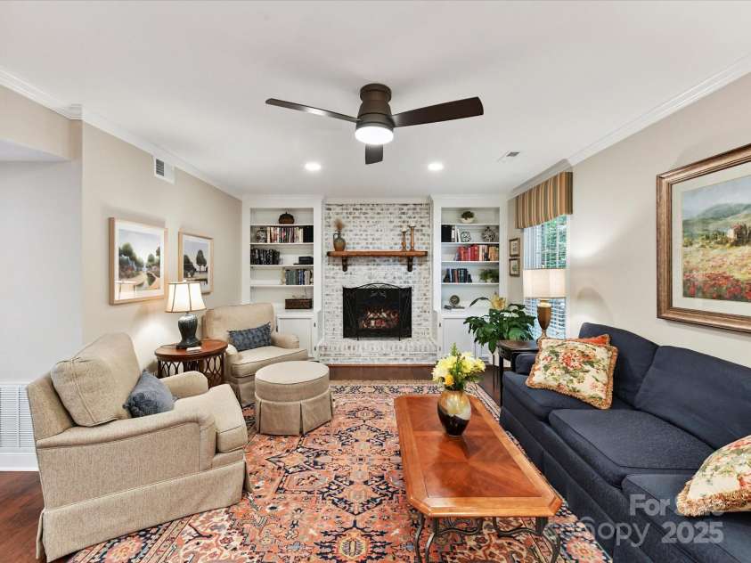 1123 Richard Barry Drive, Charlotte, NC 28270.  MLS# CAR4279129, YatesRealty ID 25965. Den featuring gas fireplace