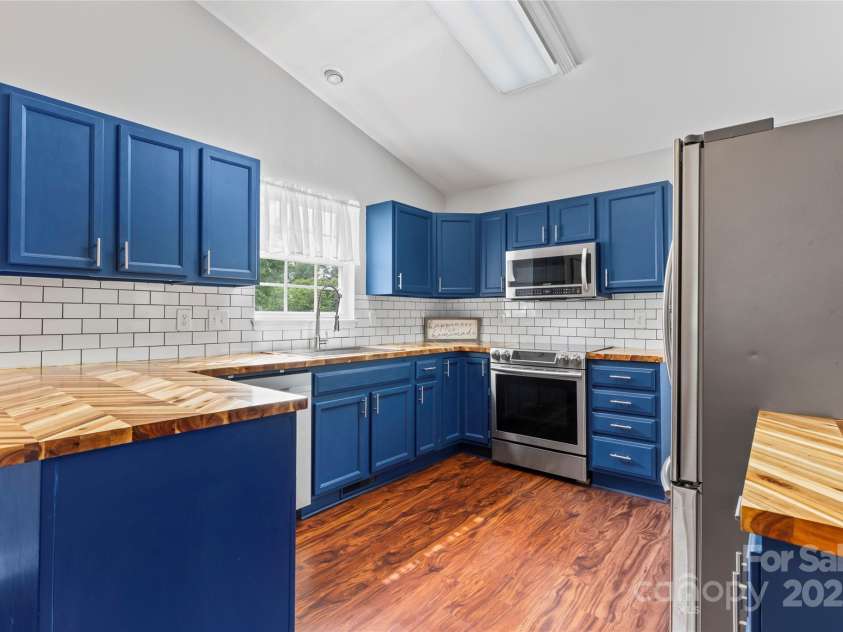 110 Bost Circle, Rockwell, NC 28138.  MLS# CAR4278101, YatesRealty ID 25967. Modern kitchen with stunning butcher block counters