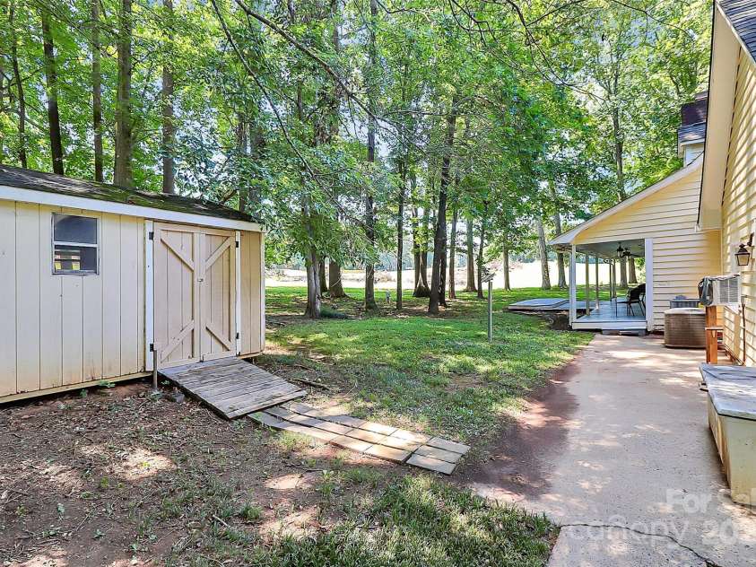 7852 Golf Course Drive, Denver, NC 28037.  MLS# CAR4264483, YatesRealty ID 25973. REAR YARD LOOKING TOWARDS FAIRWAY