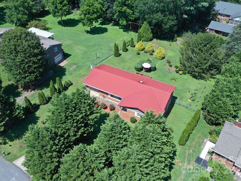 209 Northwood Drive, Morganton, NC 28655.  MLS# CAR4280216, YatesRealty ID 25981. Aerial view highlighting mature landscaping and privacy