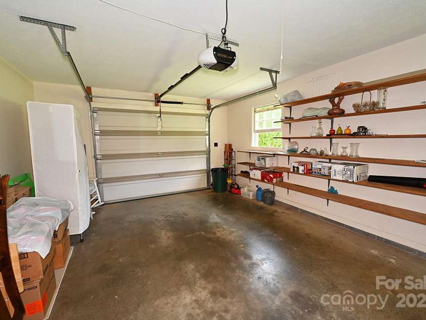 209 Northwood Drive, Morganton, NC 28655.  MLS# CAR4280216, YatesRealty ID 25981. Garage space and shelving for storage