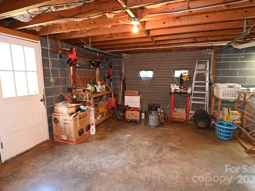 209 Northwood Drive, Morganton, NC 28655.  MLS# CAR4280216, YatesRealty ID 25981. Walk out basement door to the fenced backyard. Additional basement garage door
