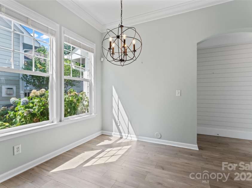 17514 Harbor Walk Drive, Cornelius, NC 28031.  MLS# CAR4276701, YatesRealty ID 25986. Kitchen dining, entrance to garage & back yard