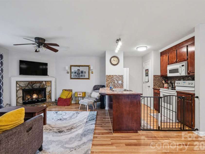 3240 Carlyle Drive, Concord, NC 28027.  MLS# CAR4348837, YatesRealty ID 25988. Foyer view of living room and kitchen