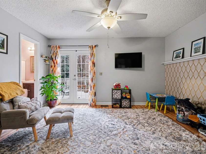 3240 Carlyle Drive, Concord, NC 28027.  MLS# CAR4348837, YatesRealty ID 25988. Primary Bedroom with french door access to back deck