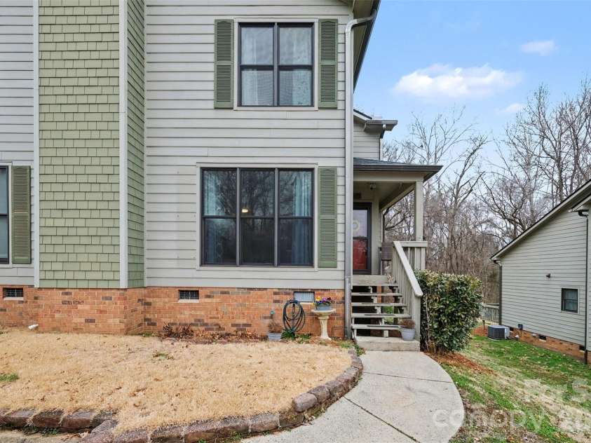 3240 Carlyle Drive, Concord, NC 28027.  MLS# CAR4348837, YatesRealty ID 25988. Walkway and front porch to your new home