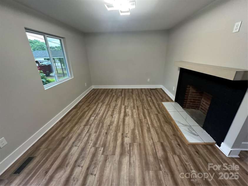 423 Rhyne Street, Dallas, NC 28034.  MLS# CAR4255293, YatesRealty ID 25988. Great Room with Woodburning Fireplace