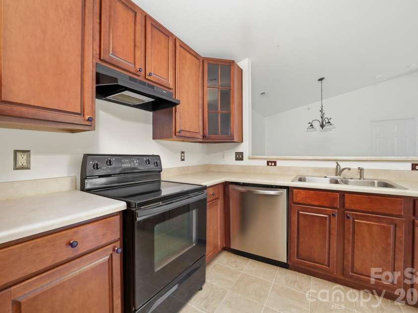 9976 Hyde Glen Court, Charlotte, NC 28262.  MLS# CAR4377383, YatesRealty ID 25991. Kitchen looking into the dining area