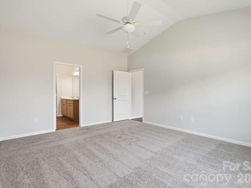 223 Rodeo Drive, Shelby, NC 28150.  MLS# CAR4369805, YatesRealty ID 26002. Primary Bedroom into primary bath