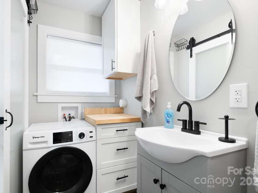16 Cottage Drive, Asheville, NC 28805.  MLS# CAR4280433, YatesRealty ID 26003. Laundry and Storage in Bathroom
