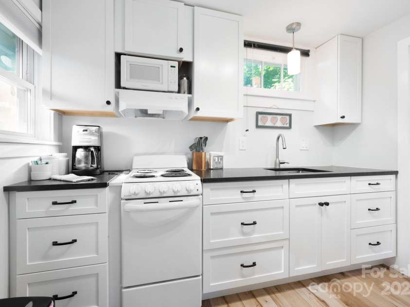 15 & 16 Cottage Drive, Asheville, NC 28805.  MLS# CAR4281267, YatesRealty ID 26004. 15 Cottage- Bright Kitchen with Storage