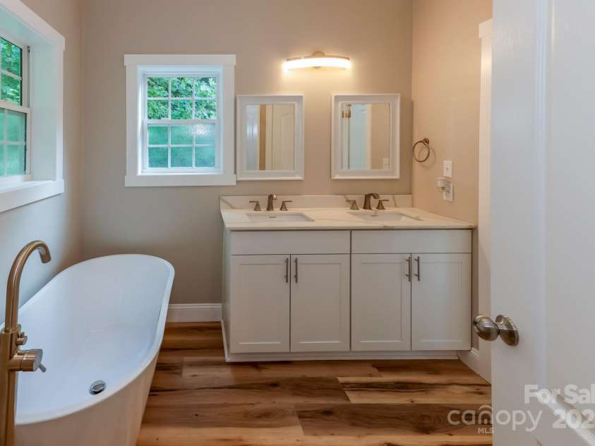 402 Sweetbriar Road, Lake Lure, NC 28746.  MLS# CAR4281606, YatesRealty ID 26005. Main level primary bath