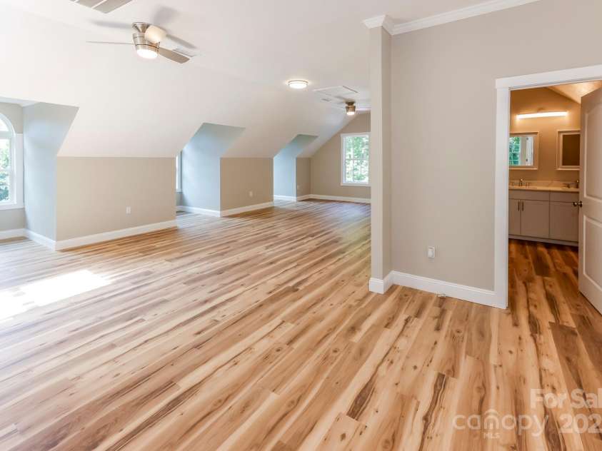 402 Sweetbriar Road, Lake Lure, NC 28746.  MLS# CAR4281606, YatesRealty ID 26005. Upper level primary bedroom