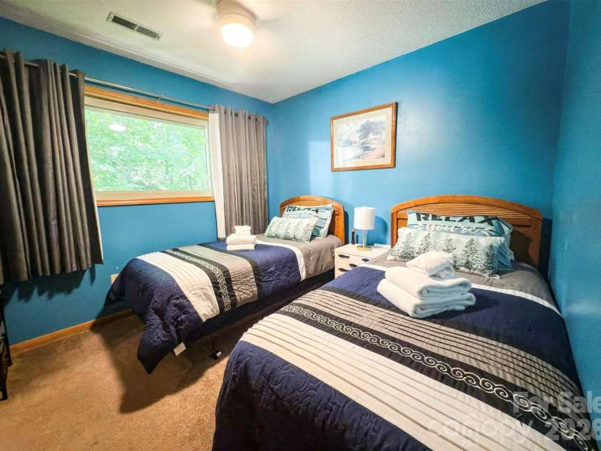 222 West Lake Drive, Lake Lure, NC 28746.  MLS# CAR4294335, YatesRealty ID 2601.  Bedroom second level