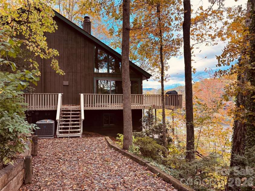 222 West Lake Drive, Lake Lure, NC 28746.  MLS# CAR4294335, YatesRealty ID 2601. Lake House in the Fall