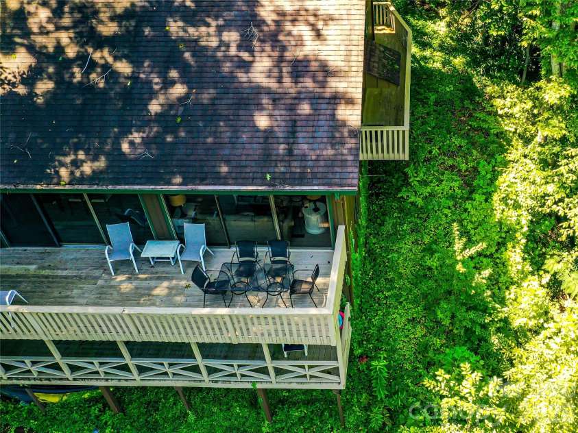 222 West Lake Drive, Lake Lure, NC 28746.  MLS# CAR4294335, YatesRealty ID 2601. Main level wrap around deck