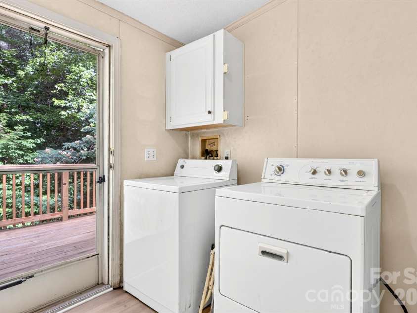 388 Chinquapin Lane, Mt Ulla, NC 28125.  MLS# CAR4344888, YatesRealty ID 2601. Inside Laundry Room has exterior door to back deck. New LVP floors! New hot water heater!