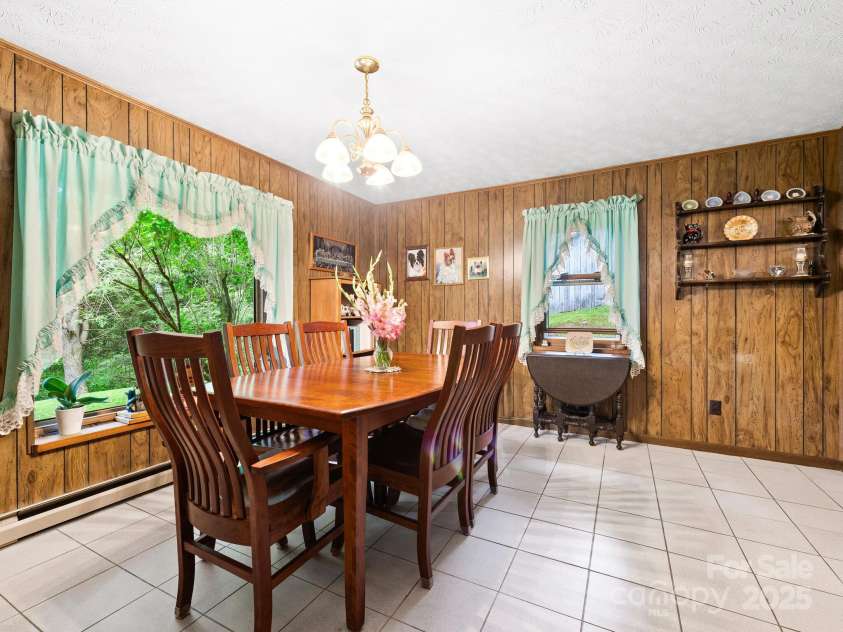 1400 Watershed Road, Mars Hill, NC 28754.  MLS# CAR4280588, YatesRealty ID 26016. Another angle of the dining room on bottom level. The kitchen is to the right of this photo.