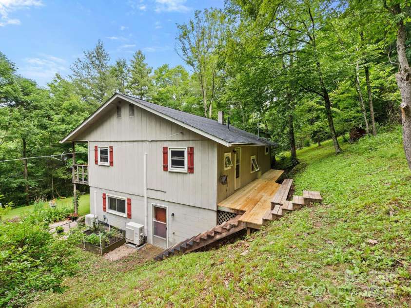 1400 Watershed Road, Mars Hill, NC 28754.  MLS# CAR4280588, YatesRealty ID 26016. Back of home with brand new decking boards on deck.