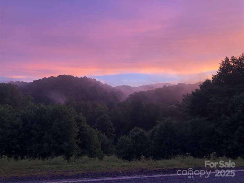 1400 Watershed Road, Mars Hill, NC 28754.  MLS# CAR4280588, YatesRealty ID 26016. Enjoy extraordinary sunsets in the winter from the living room windows and front porch.