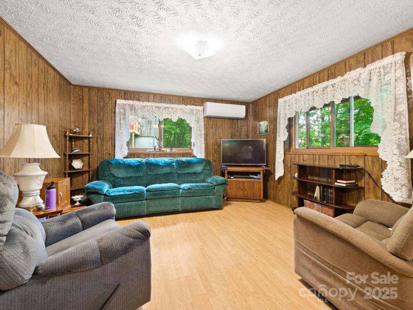1400 Watershed Road, Mars Hill, NC 28754.  MLS# CAR4280588, YatesRealty ID 26016. Living room looking from  near dining room near front door.