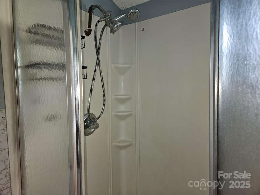 6813 Navajo Trail, Sherrills Ford, NC 28673.  MLS# CAR4253996, YatesRealty ID 26022. Standup Shower with Handheld and Mounted Shower Heads