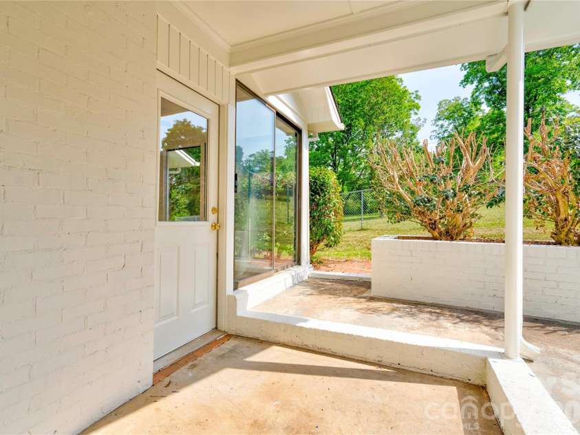 809 Forest Hill Drive, Shelby, NC 28150.  MLS# CAR4385208, YatesRealty ID 26022. Side entrance and patio.