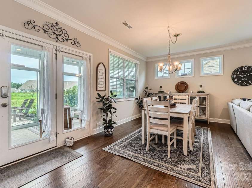 125 Rosebay Drive, Mooresville, NC 28117.  MLS# CAR4269839, YatesRealty ID 26027. Dining Area Into Three Season Patio