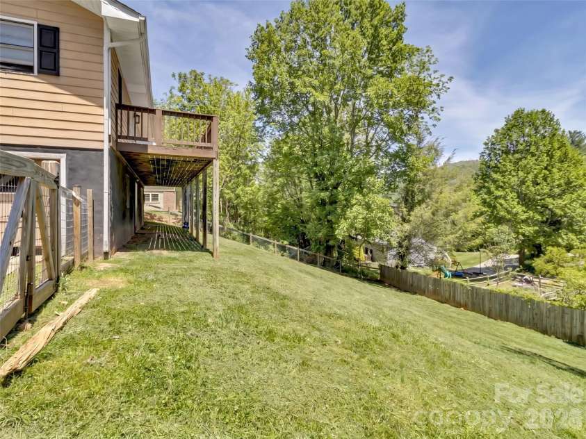 252 Oak Park Drive, Clyde, NC 28721.  MLS# CAR4381377, YatesRealty ID 26039. Completely fenced back yard