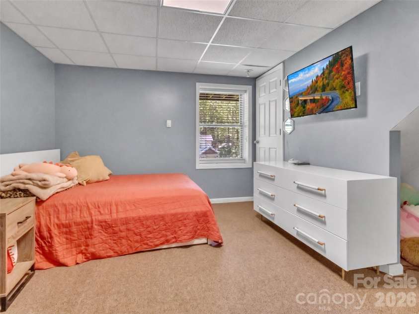 252 Oak Park Drive, Clyde, NC 28721.  MLS# CAR4381377, YatesRealty ID 26039. Lower level bedroom #4