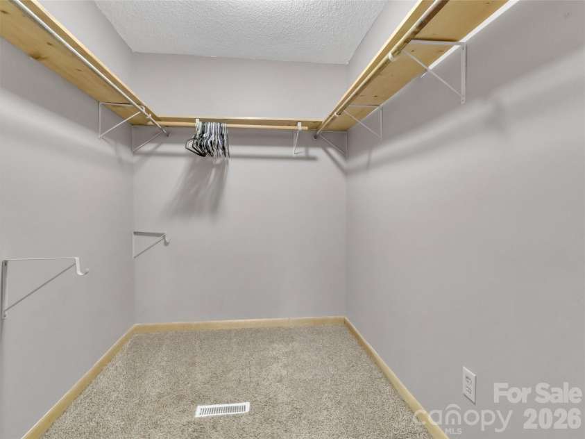 252 Oak Park Drive, Clyde, NC 28721.  MLS# CAR4381377, YatesRealty ID 26039. Walk in closet in primary