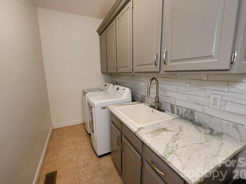 406 5th Avenue, Conover, NC 28613.  MLS# CAR4368101, YatesRealty ID 26041. Laundry Room with sink Main Level