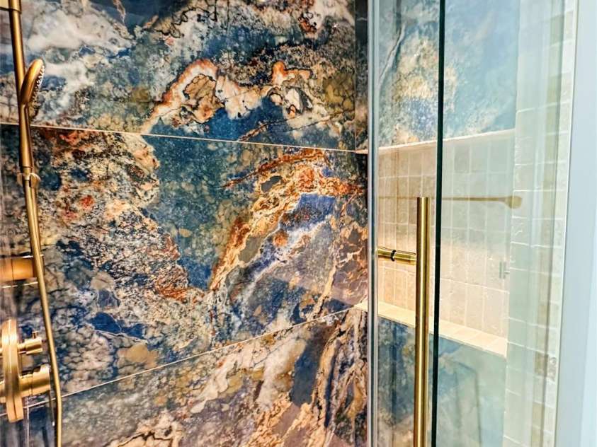671 Alexander Street, Charlotte, NC 28202.  MLS# CAR4336342, YatesRealty ID 2605. Beautifully updated shower with tile and glass