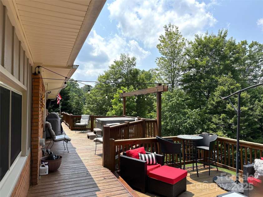 47 Fairlane Drive, Waynesville, NC 28786.  MLS# CAR4267951, YatesRealty ID 26065. Fire up the grill and Entertain on this Wrap Around Deck with gates
