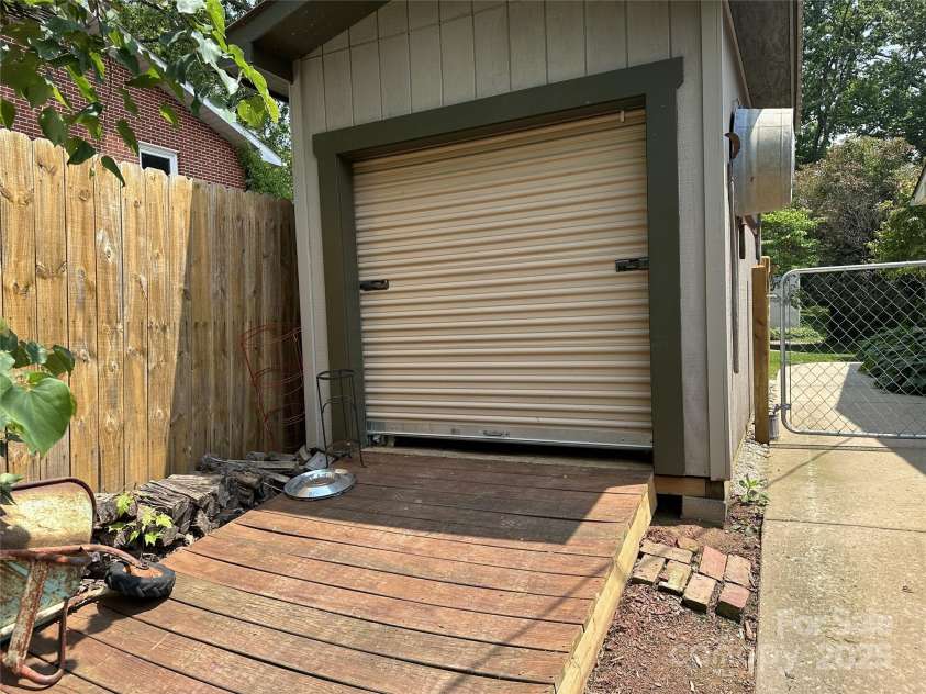 47 Fairlane Drive, Waynesville, NC 28786.  MLS# CAR4267951, YatesRealty ID 26065. Garage door for ease of lawn mower using the ramp