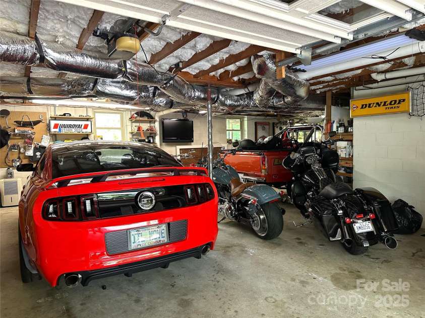 47 Fairlane Drive, Waynesville, NC 28786.  MLS# CAR4267951, YatesRealty ID 26065. Garage holds car, truck, motorcycles and so much more!