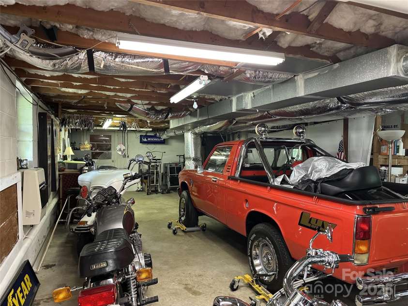 47 Fairlane Drive, Waynesville, NC 28786.  MLS# CAR4267951, YatesRealty ID 26065. More Storage, steps to main floor, 2nd washer/dryer hookup, and gas heater.