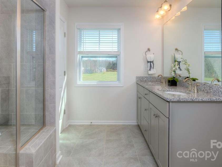 288 Creekview Road, Hendersonville, NC 28792.  MLS# CAR4161750, YatesRealty ID 26070. Owners Bath with granite counters