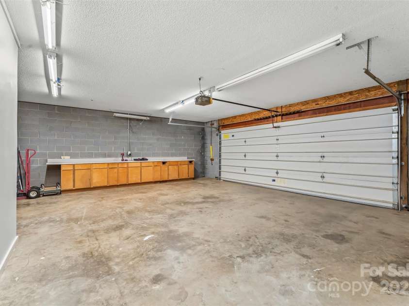 178 Herron Cove Road, Weaverville, NC 28787.  MLS# CAR4257698, YatesRealty ID 26072. Spacious garage