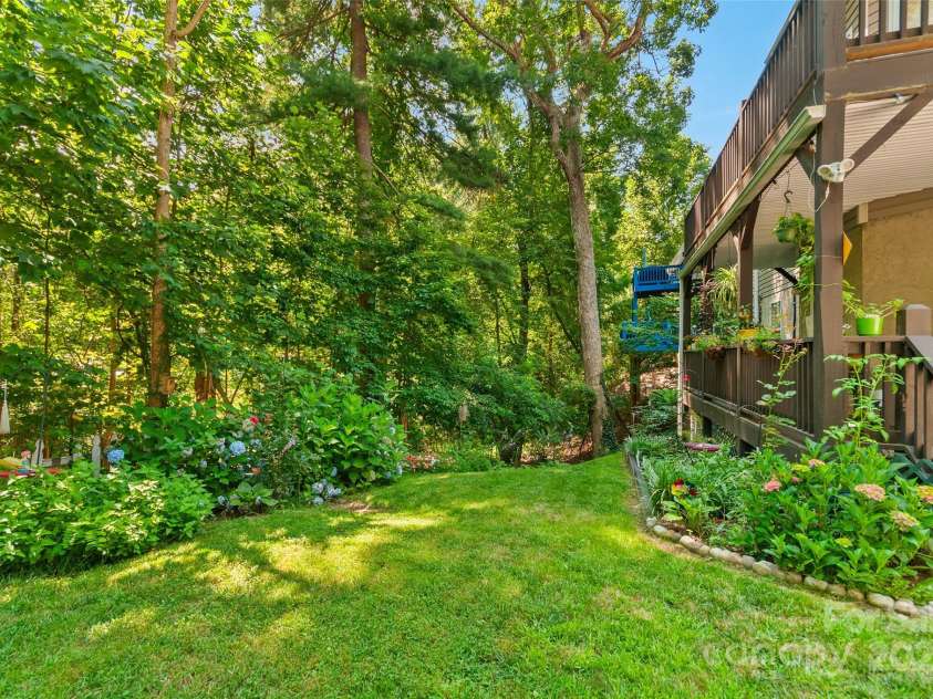 28 Grove Garden Avenue, Candler, NC 28715.  MLS# CAR4278254, YatesRealty ID 26090. Back yard