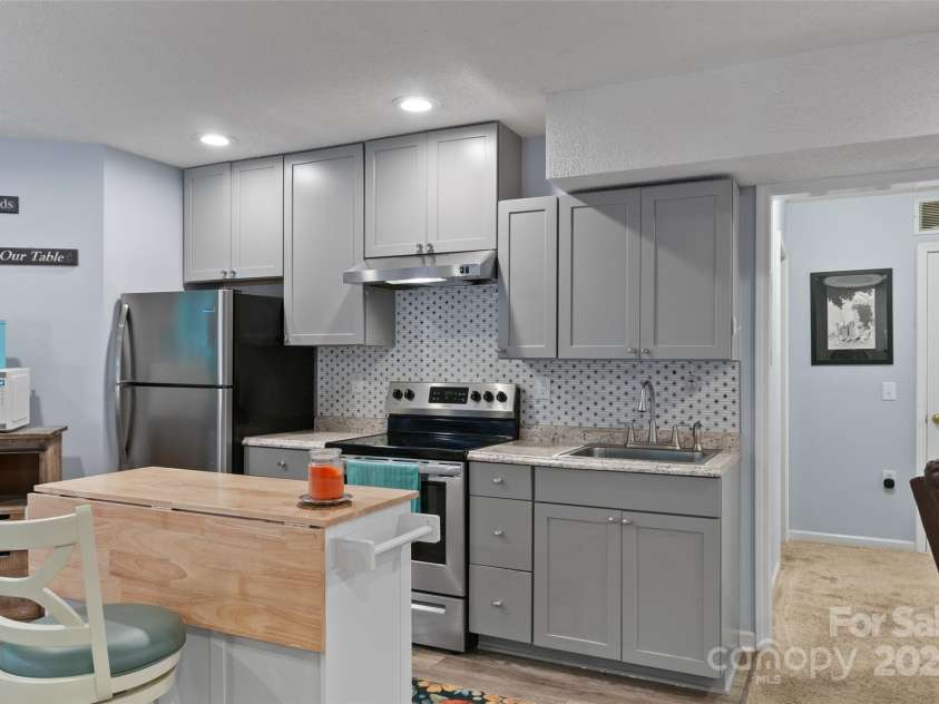 28 Grove Garden Avenue, Candler, NC 28715.  MLS# CAR4278254, YatesRealty ID 26090. Downstairs 2nd kitchen