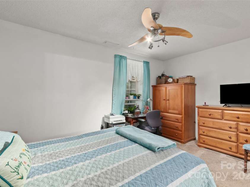 28 Grove Garden Avenue, Candler, NC 28715.  MLS# CAR4278254, YatesRealty ID 26090. Downstairs bedroom