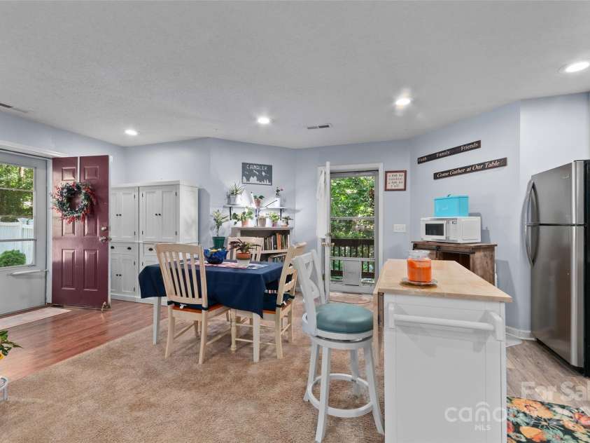 28 Grove Garden Avenue, Candler, NC 28715.  MLS# CAR4278254, YatesRealty ID 26090. Downstairs kitchen and dining area